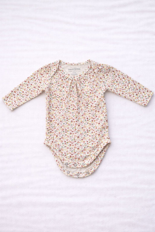 Body blanco de flores 3-6 meses